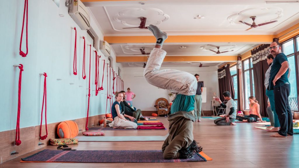 Crafting Captivating Headlines: Your awesome post title goes here Participants practicing yoga in a Rishikesh studio, showcasing flexibility and wellbeing.